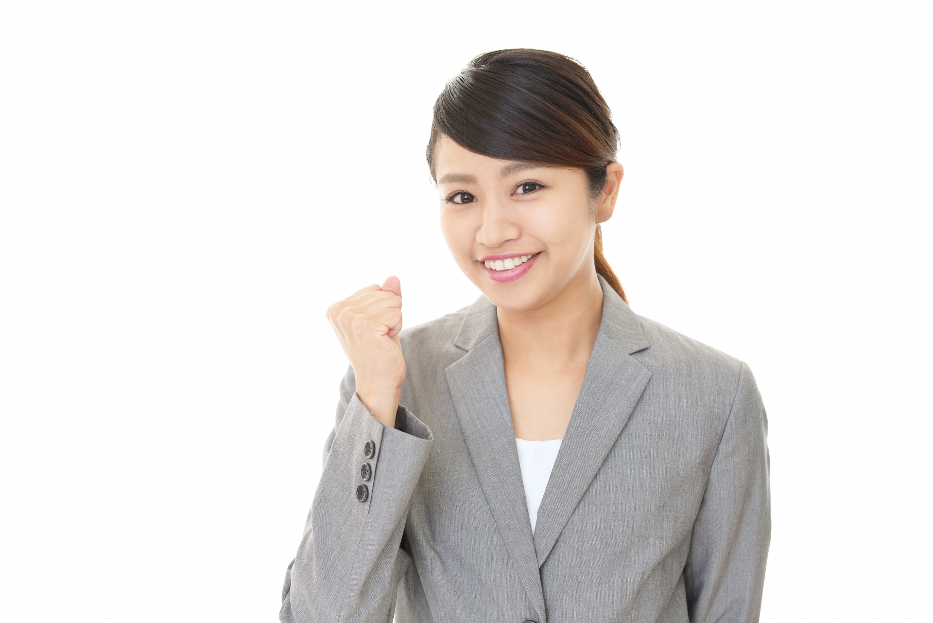 ガッツポーズの若い女性