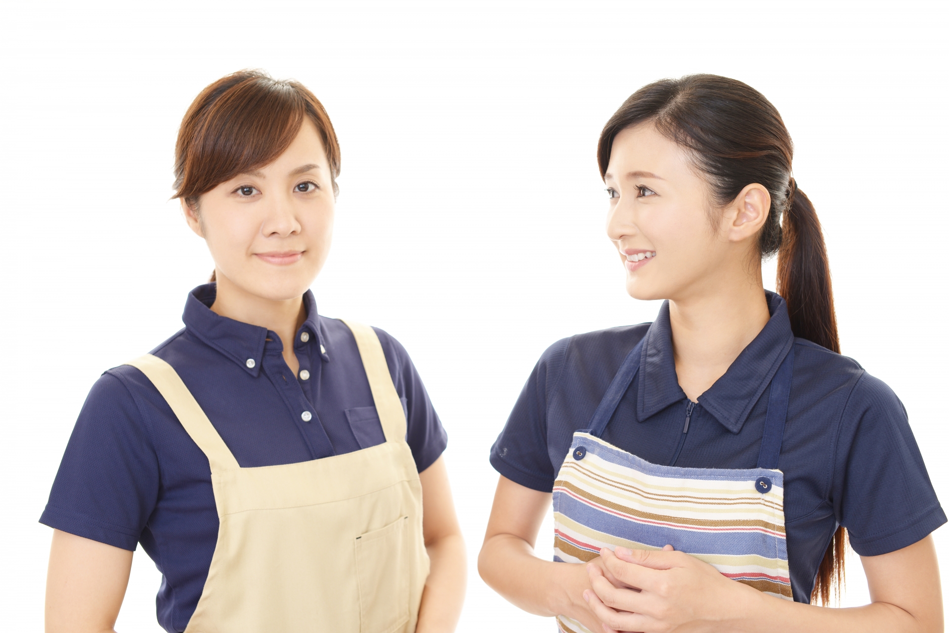 エプロンを着た二人の女性