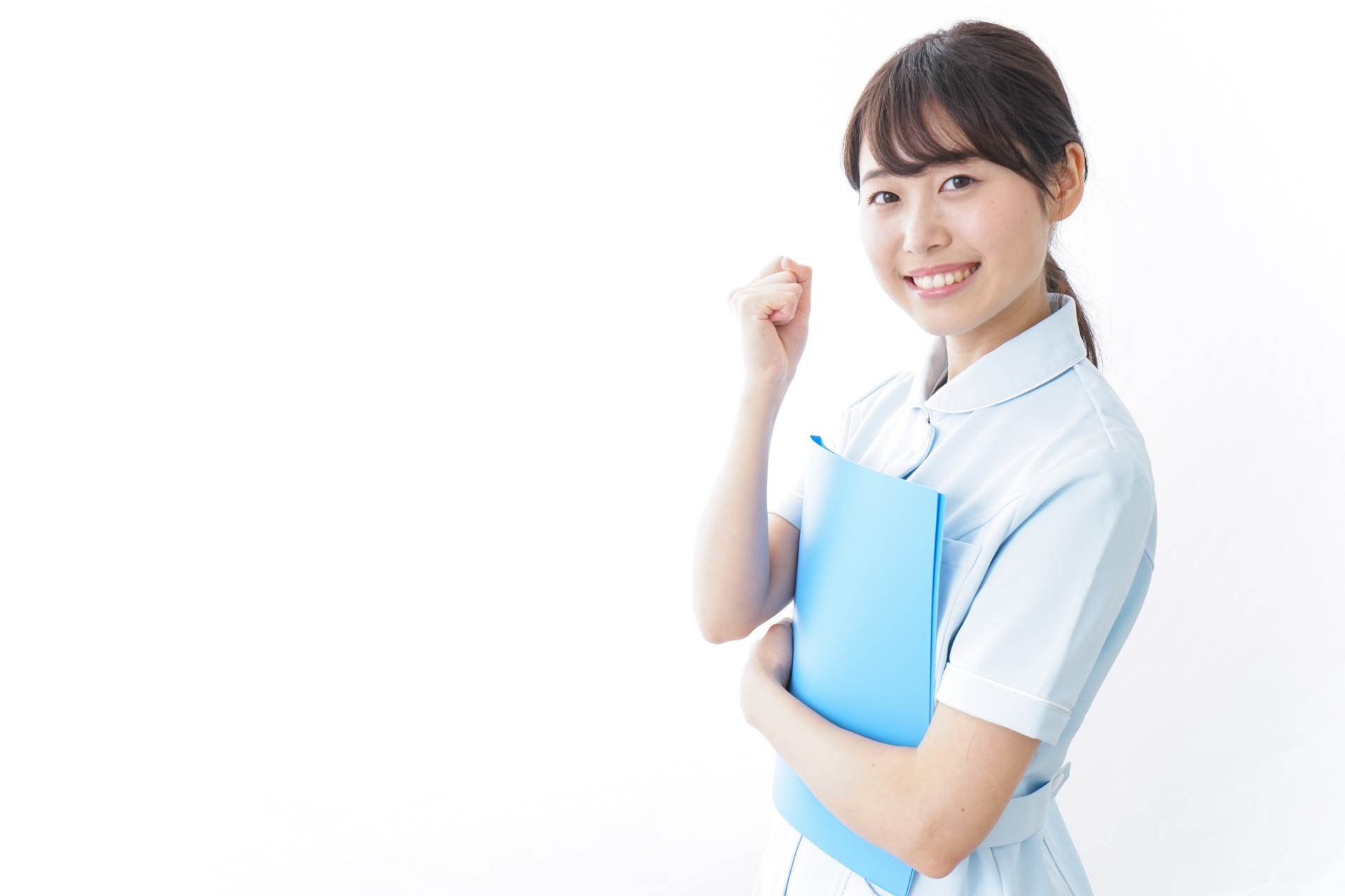 ガッツポーズをする看護師