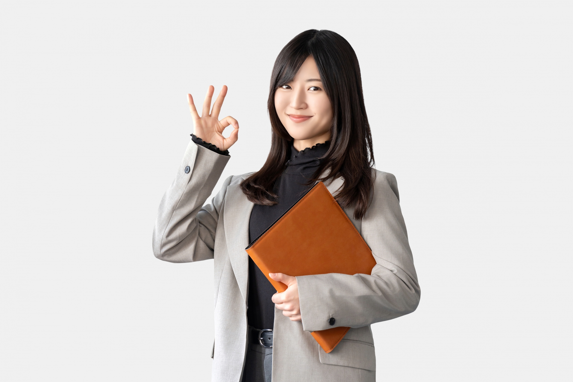 OKポーズをする笑顔のビジネスウーマン