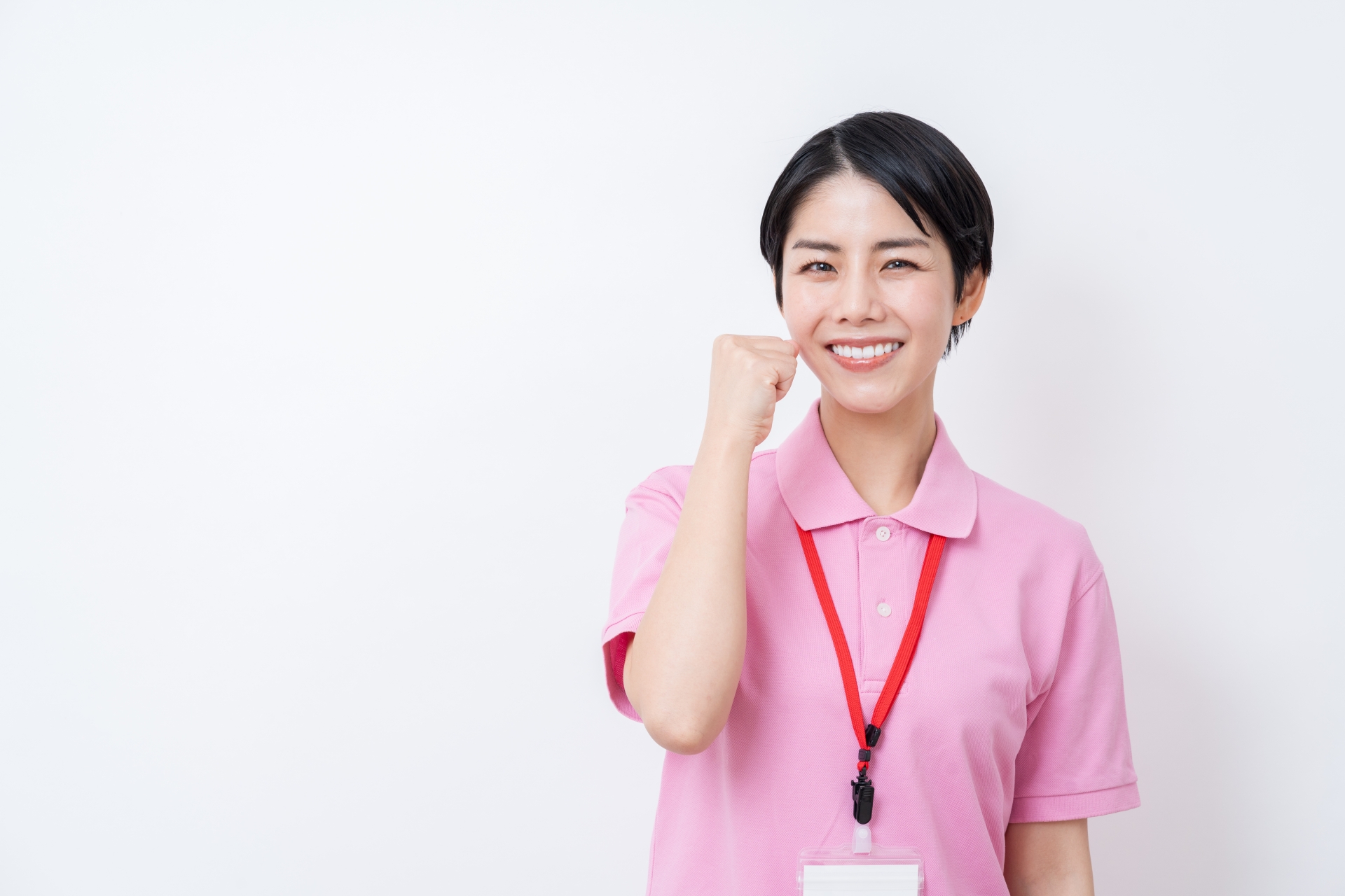 ガッツポーズをする介護士
