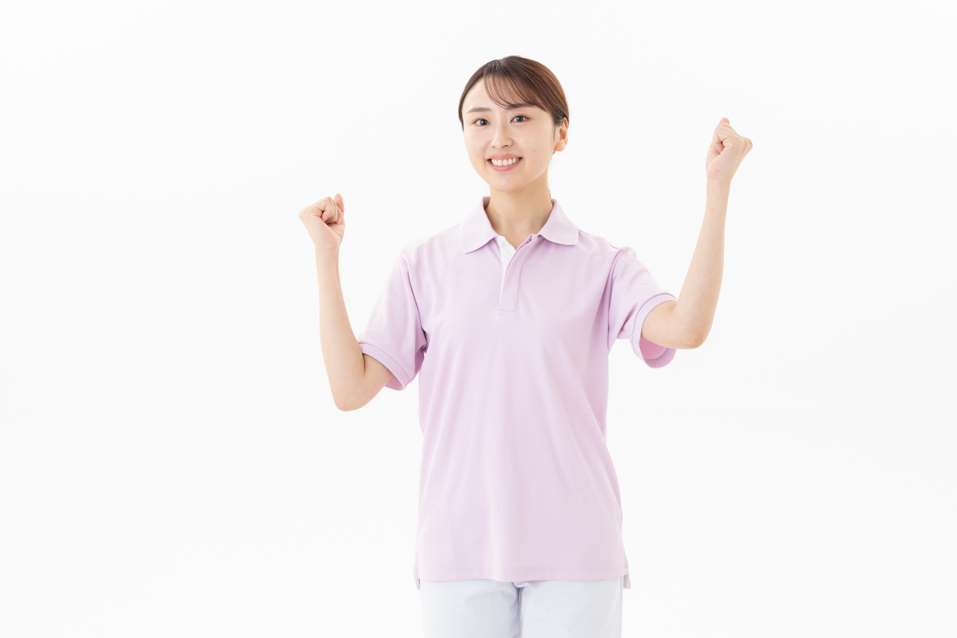 両手でガッツポーズをする女性