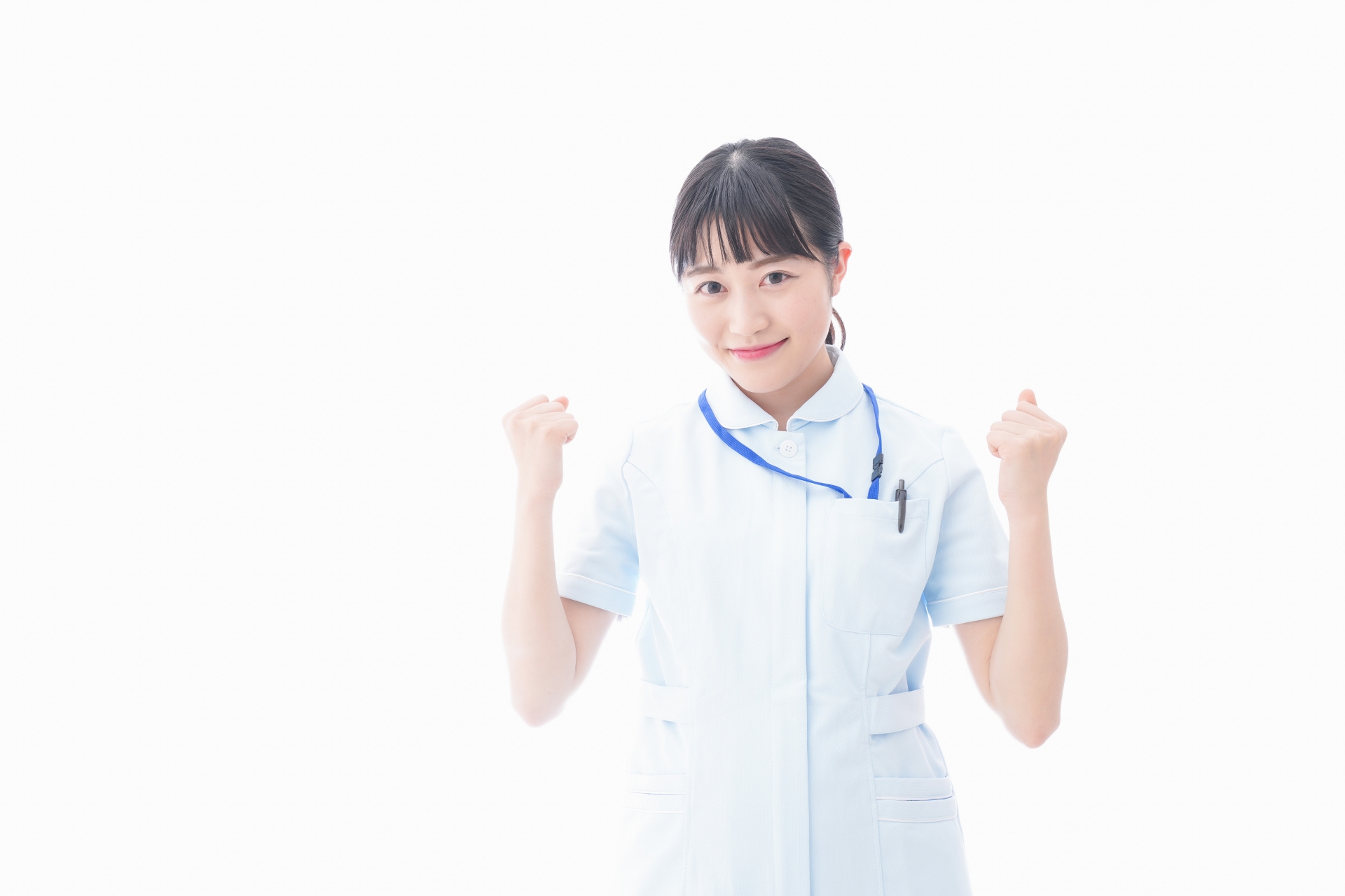 ガッツポーズをする若い看護師