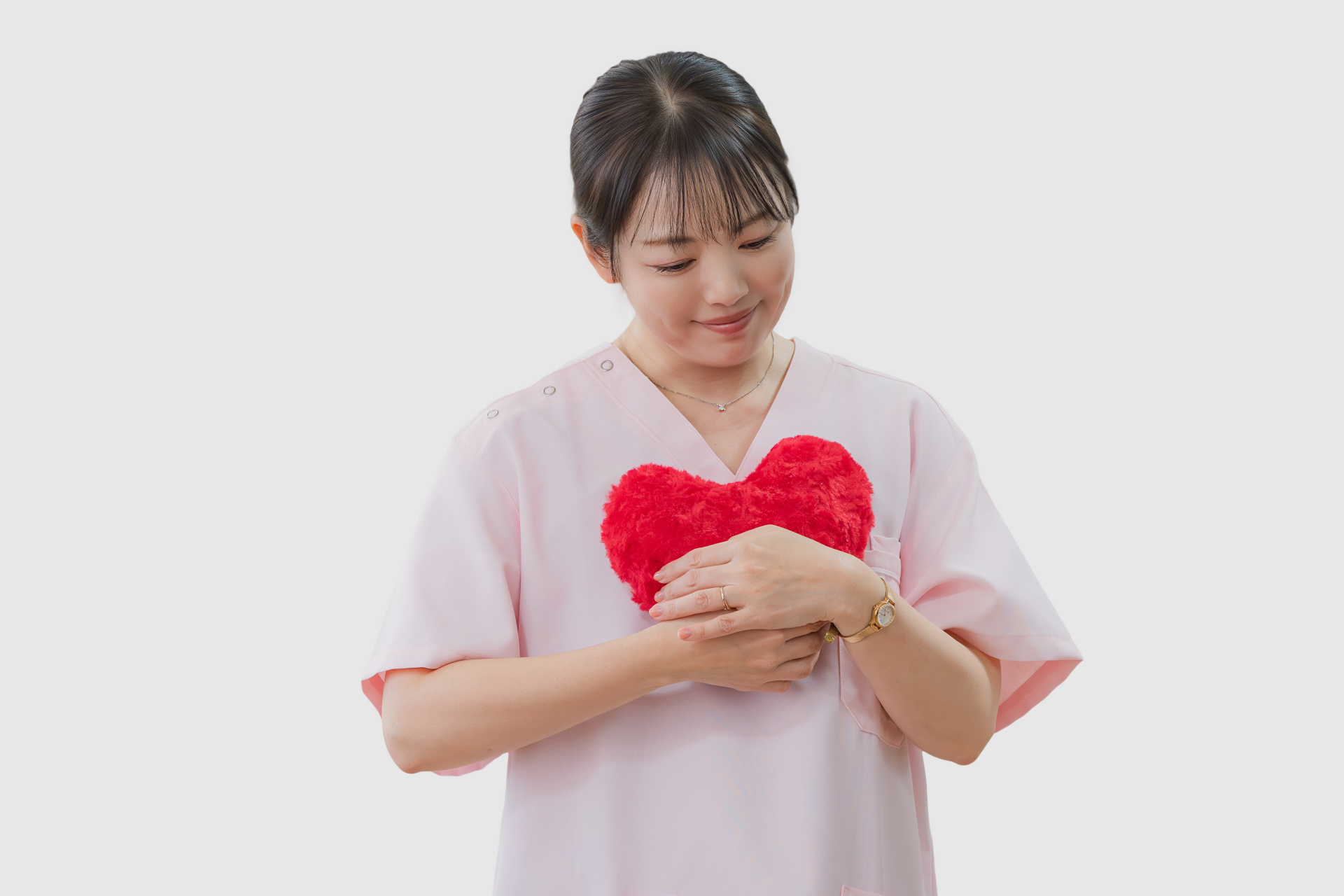 ハートを抱く介護士女性